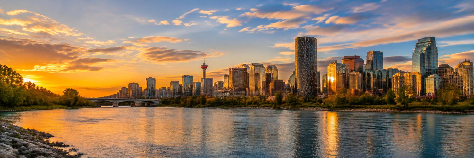Calgary skyline at golden hour over the Bow River